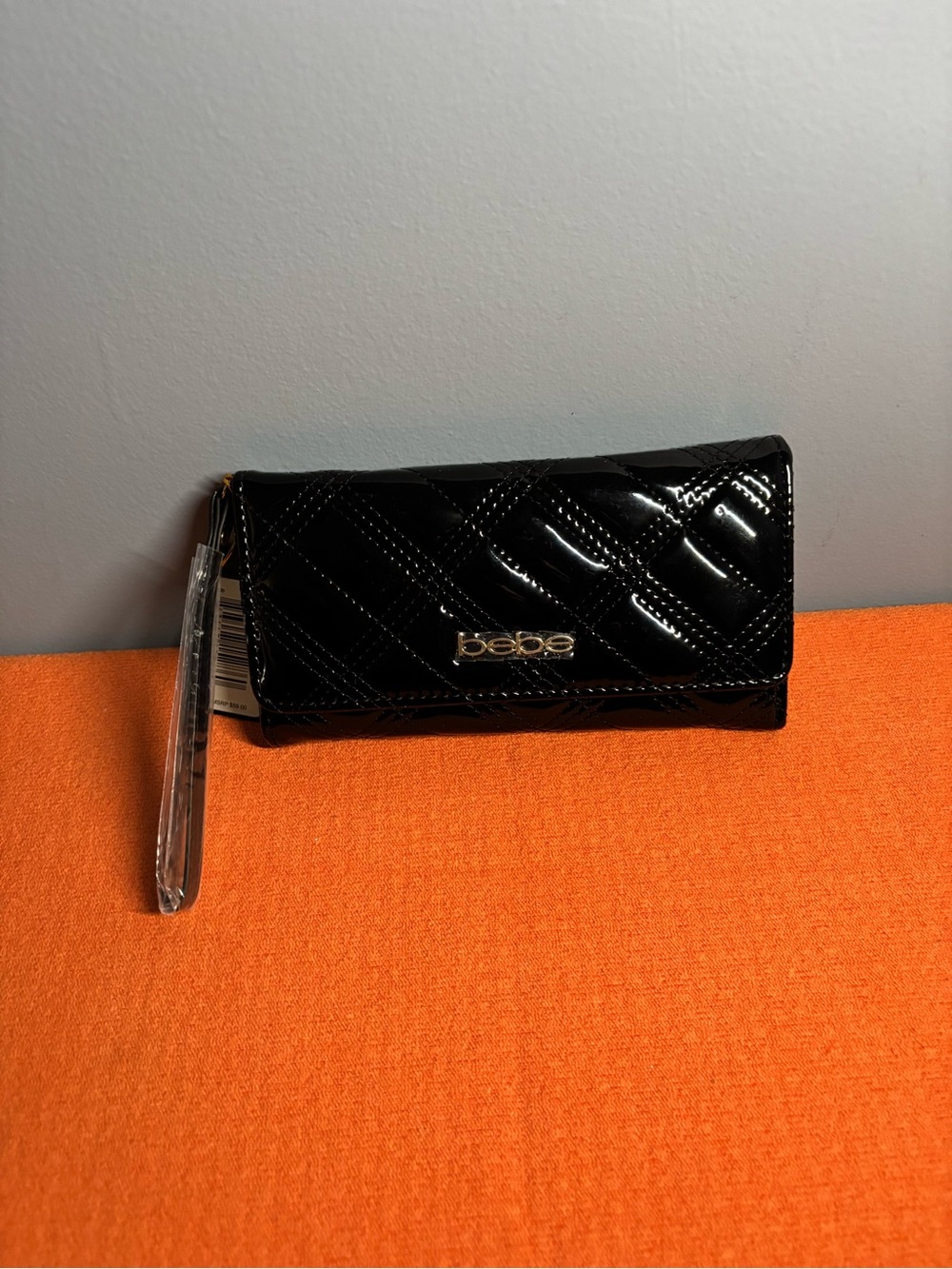 bebe Camron Black Embossed Tri-Fold Wallet with Gold Logo